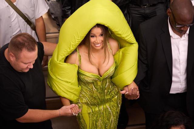 PHOTO: Cardi B flashes her ample cleavage in a neon dress while posing with  Offset