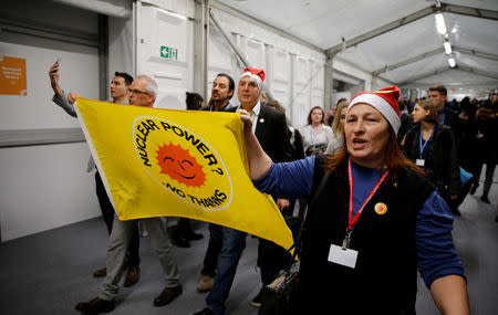 Environmental activists protest against fossil fuel during U.S. panel at the COP24 UN Climate Change Conference 2018 in Katowice, Poland December 10, 2018