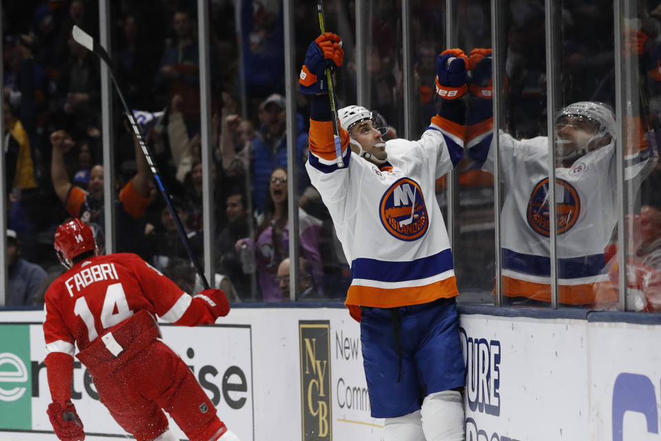New York Islanders right wing Jordan Eberle reacts toward the crowd after scoring his second goal of the night, during the second period of the team's NHL hockey gam against the Detroit Red Wings ,as Red Wings center Robby Fabbri (14) skates away, Friday, Feb. 21, 2020, in Uniondale, N.Y. (AP Photo/Kathy Willens)