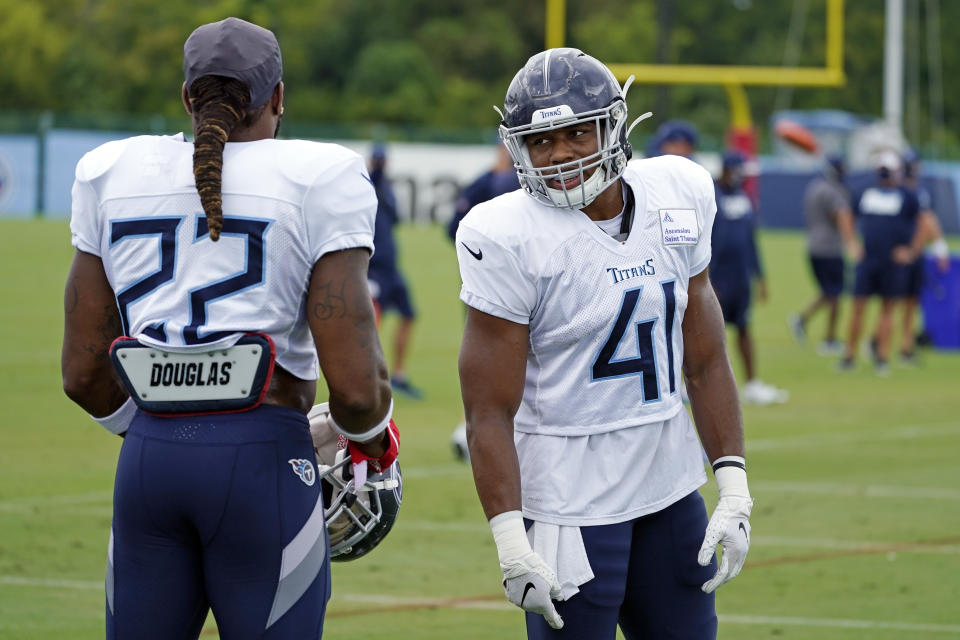 Tennessee Titans running back Khari Blasingame (41) talks with running back Derrick Henry (22) during NFL football training camp Friday, Aug. 28, 2020, in Nashville, Tenn. (AP Photo/Mark Humphrey, Pool)