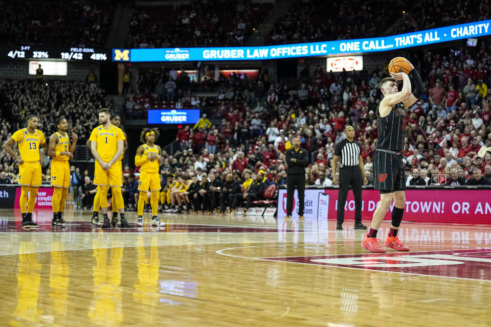 Wisconsin's Connor Essegian (3) shoots a technical foul against Michigan during the second half of an NCAA college basketball game Tuesday, Feb. 14, 2023, in Madison, Wis. (AP Photo/Andy Manis)