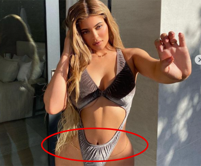 Image of Kylie Jenner in Skims bodysuit with body chain highlighted by red circle new bikini trend