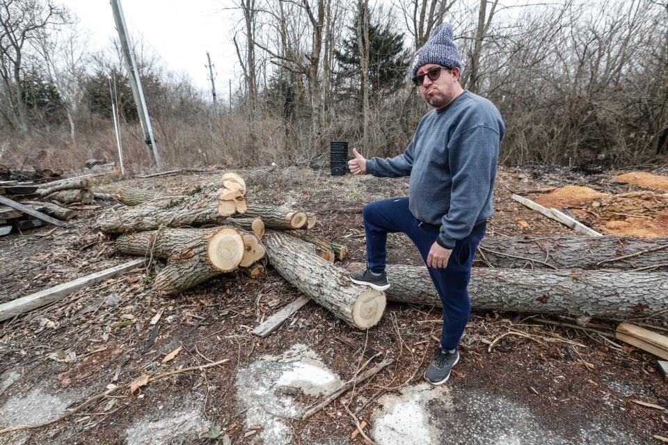 Brian Presnell, owner of Indy Urban Hardwood shows off trees harvested from the Virginia B. Fairbanks Art & Nature Park at the Indianapolis Museum of Art, on Tuesday, March 8, 2022, at Indy Urban Hardwood in Indianapolis. Wood harvested from the IMA will be used to make an array of furniture and other wooden items for the Newfields campus. 