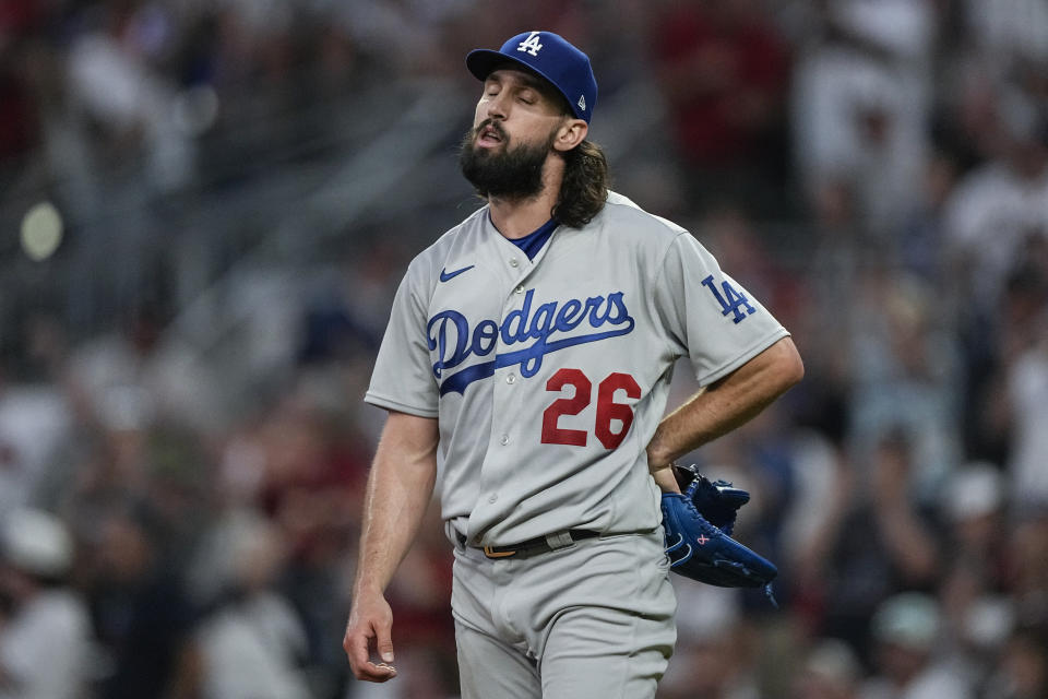 Los Angeles Dodgers starting pitcher Tony Gonsolin reacts after giving up a home run to Atlanta Braves' Marcell Ozuna during the fifth inning of a baseball game Wednesday, May 24, 2023, in Atlanta. (AP Photo/John Bazemore)