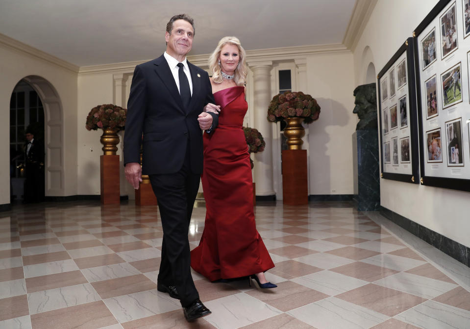 FILE- In this Oct. 18, 2016 file photo, Gov. Andrew Cuomo, D-N.Y., is accompanied by his girlfriend Sandra Lee as they arrive for a state dinner at the White House in Washington. The couple announced on Wednesday, Sept. 25, 2019 that they have broken up after more than a decade together. (AP Photo/Alex Brandon, File)