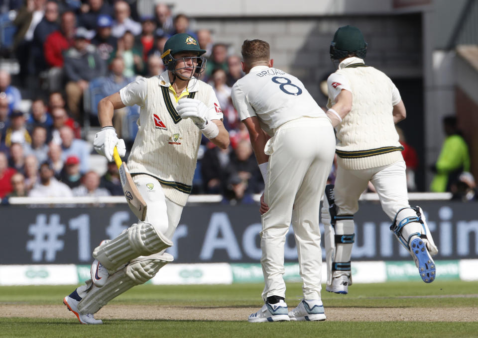 Australia's Marnus Labuschagne, left, and Steve Smith take a run during day one of the fourth Ashes Test cricket match between England and Australia at Old Trafford in Manchester, England, Wednesday, Sept. 4, 2019. (AP Photo/Rui Vieira)