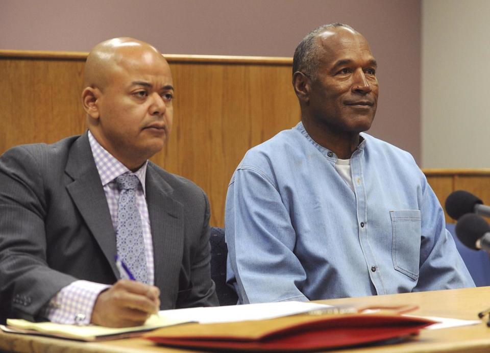 OJ Simpson with his attorney, Malcolm LaVergne at the parole hearing (AP)