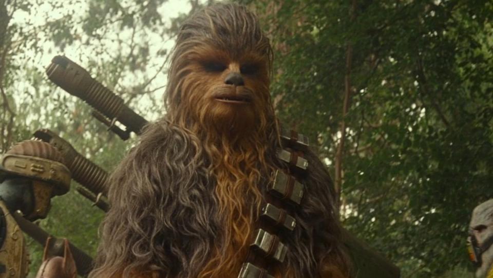 Chewbacca with a large weapon on his back in The Rise of Skywalker