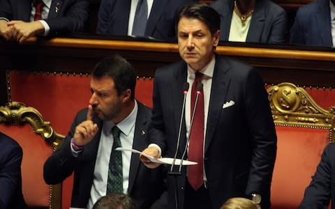 Italian Prime Minister Giuseppe Conte (C), flanked by Deputy Prime Minister and Interior Minister Matteo Salvini (L) delivers a speech at the Italian Senate, in Rome - Credit: Marco Ravagli / Barcroft Media&nbsp;