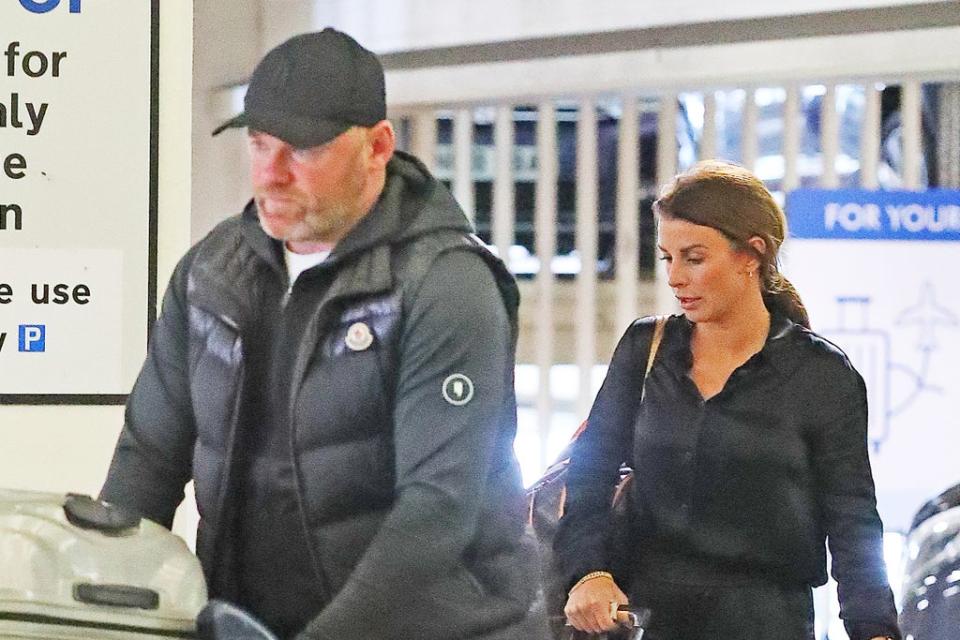 Wayne and Coleen Rooney arrive at Manchester Airport  (Eamonn and  James Clarke)