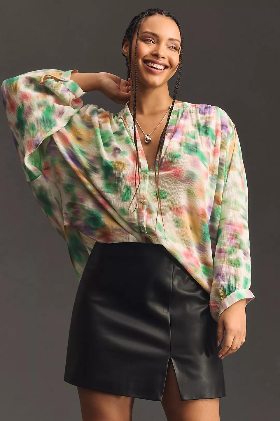 model wearing tie dye button down blouse