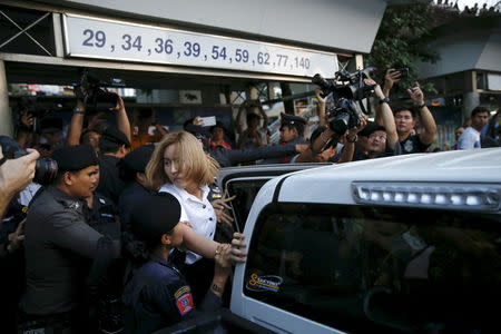 A student activist is detained during a silent protest after Thailand's election commission filed charges against a group for posting "foul and strong" comments online criticising a military-backed draft constitution, in Bangkok, Thailand April 27, 2016. REUTERS/Jorge Silva