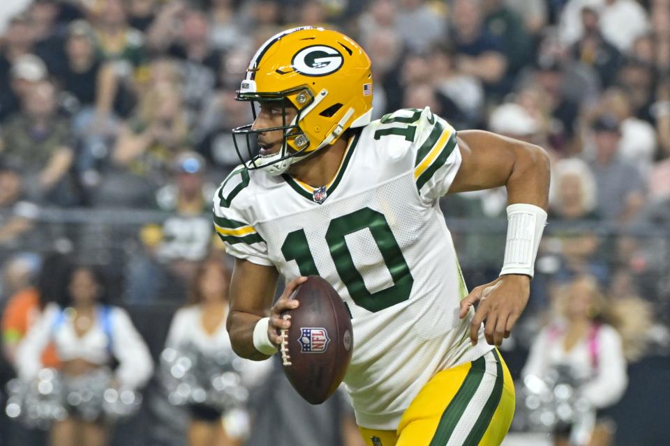 Green Bay Packers' Jordan Love scrambles during the second half of an NFL football game against the Las Vegas Raiders Monday, Oct. 9, 2023, in Las Vegas. (AP Photo/David Becker)