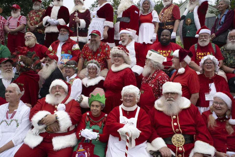 This image released by HBO Max shows a scene from “Santa Camp." The documentary follows the non-profit New England Santa Society, made up of more than 100 professional Christmas performers, who decide to tackle the lack of diversity among Santa stand-ins at their annual summer camp in New Hampshire. (HBO Max via AP)