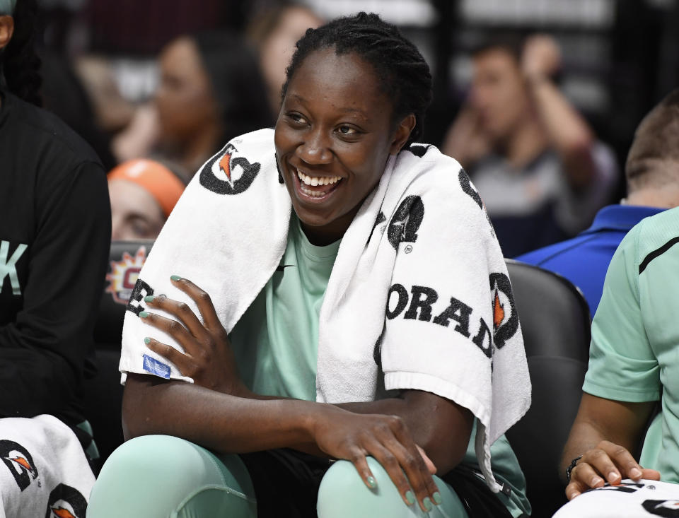 FILE - In this May 14, 2019, file photo, New York Liberty's Tina Charles smiles on the bench during the second half of a preseason WNBA basketball game in Uncasville, Conn. Several WNBA colleagues continue to be active in the fight against social injustice and police brutality, participating in protests and continuing work that they began four years ago. Charles, Natasha Cloud and others have been working toward solutions since 2016 after police shootings in Minnesota and another in Baton Rouge, Louisiana, made national headlines that year.(AP Photo/Jessica Hill, File)