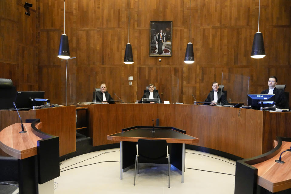 Presiding judge Boele, center, prepares to read the verdict in an appeals court in The Hague, Netherlands, Tuesday Dec. 7, 2021, after a Hague District Court had ruled in January 2020 that the case against Benny Gantz and former Israeli air force commander Amir Eshel could not proceed because the men have "functional immunity from jurisdiction". The case was brought by Ismail Ziada, a Dutch-Palestinian who lost six members of his family in the airstrike that lawyers for the men argued was part of an Israeli military operation during the 2014 Gaza conflict. (AP Photo/Peter Dejong)