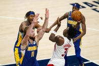 Toronto Raptors forward OG Anunoby (3) shoots over Indiana Pacers forward Domantas Sabonis (11) during the second half of an NBA basketball game in Indianapolis, Sunday, Jan. 24, 2021. (AP Photo/Michael Conroy)