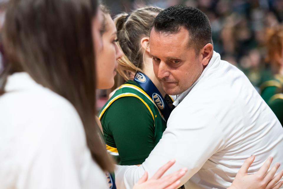 Blackhawk head coach Steve Lodovico hugs one his players after falling in the PIAA Class 4A Girls' Basketball Championship against Lansdale Catholic at the Giant Center on March 25, 2023, in Hershey. The Crusaders won, 53-45.