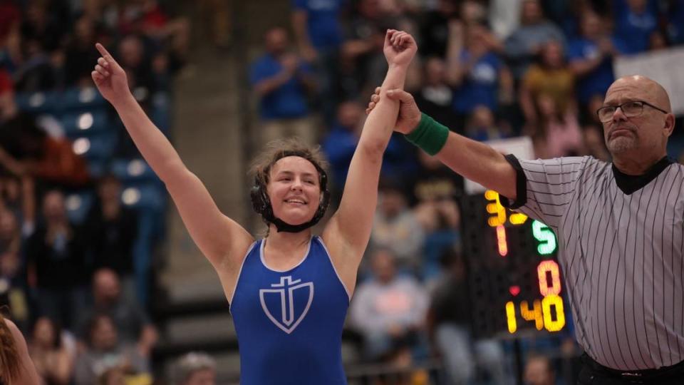 Kapaun Mt. Carmel senior Jayla Johnson celebrates becoming the first girls wrestling state champion in school history.