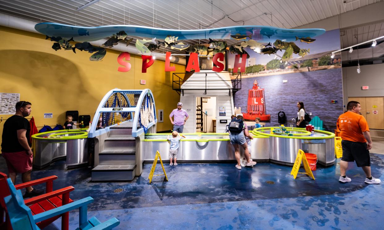 Kids play in a water-based exhibit at the Children's Museum of Green Bay on June 25, 2023, in Green Bay, Wis.