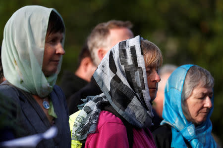 Women attend a vigil for the victims of the mosque attacks during an ecumenical celebration in Christchurch, New Zealand, March 21, 2019. REUTERS/Jorge Silva