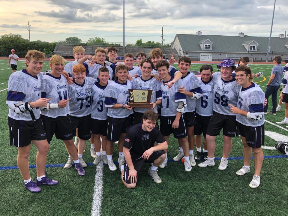 The Rumson-Fair Haven seniors take a moment with the trophy. Rumson-Fair Haven defeats Summit in the NJSIAA Group 2 State Final on June 3, 2022 at Rumson-Fair Haven Regional High School