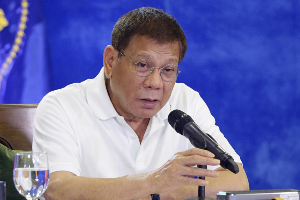 In this Monday, Feb. 15, 2021, photo provided by the Malacanang Presidential Photographers Division, Philippine President Rodrigo Duterte gestures as he meets members of the Inter-Agency Task Force on the Emerging Infectious Diseases in Davao city, southern Philippines. The Philippine president has approved an amnesty program for Muslim and communist rebels who would agree to surrender their weapons as they return to normal life in the latest such attempt to tame rural insurgencies that have raged for half a century. (Joey Dalumpines/Malacanang Presidential Photographers Division via AP)