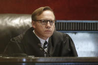 Judge Thad Balkman listens during a hearing to settle disagreements between Johnson & Johnson and the State over his finals judgement in a opioid lawsuit case, Tuesday, Oct. 15, 2019 in Norman, Okla. (AP Photo/Sue Ogrocki)