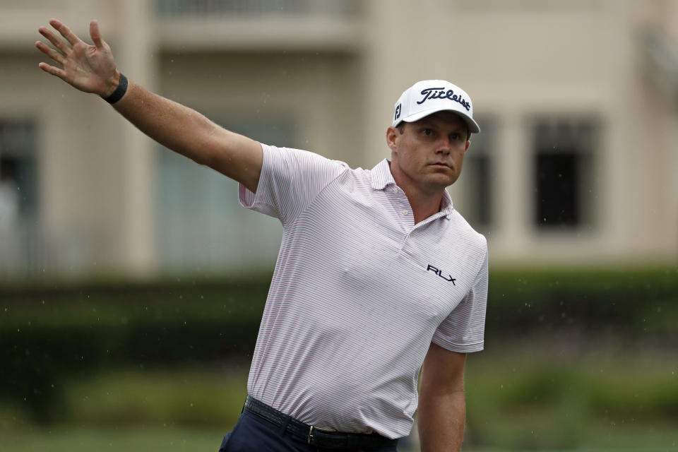 In this photo taken Thursday, June 18, 2020 Nick Watney signals after a tee shot during the first round of the RBC Heritage Golf tournament at Harbour Town Golf Links in Hilton Head, S.C. Watney has tested positive for coronavirus and did not play in Friday's round. (AP Photo/Gerry Broome)