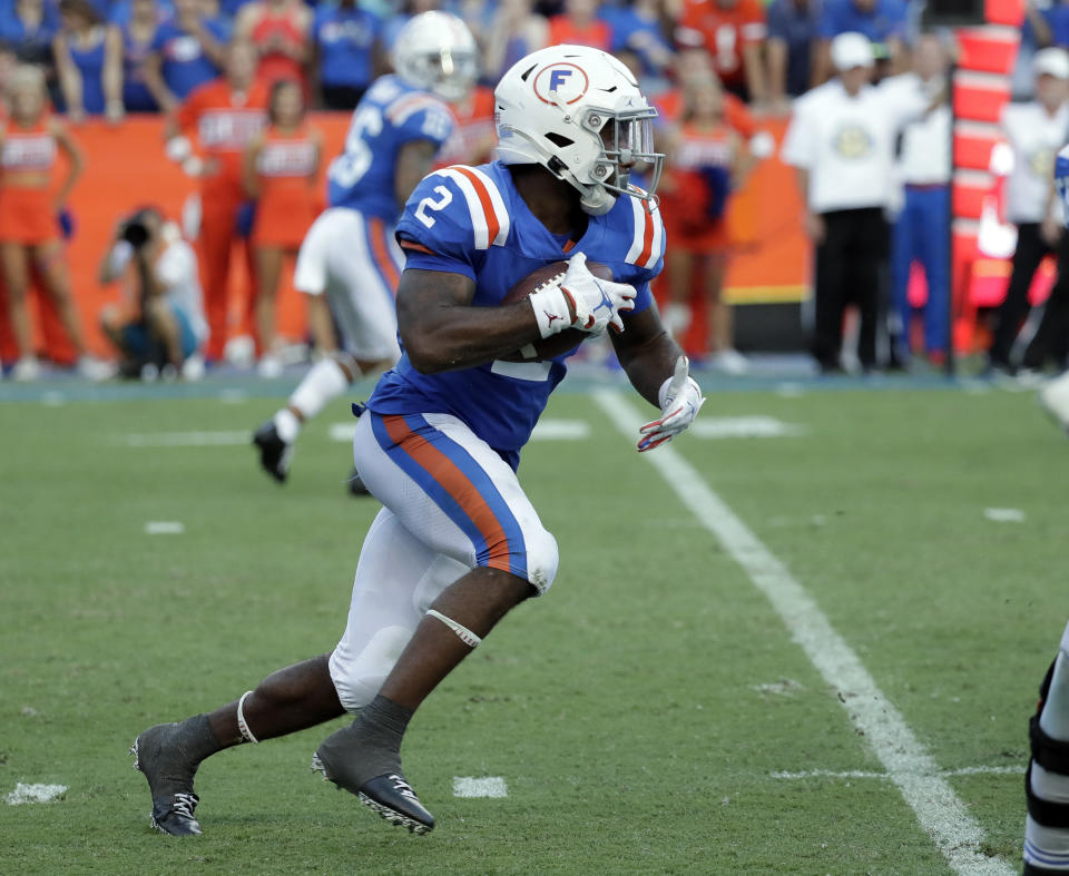 Florida running back Lamical Perine takes off on an 88-yard touchdown run against Auburn during the second half of an NCAA college football game, Saturday, Oct. 5, 2019, in Gainesville, Fla. (AP Photo/John Raoux)