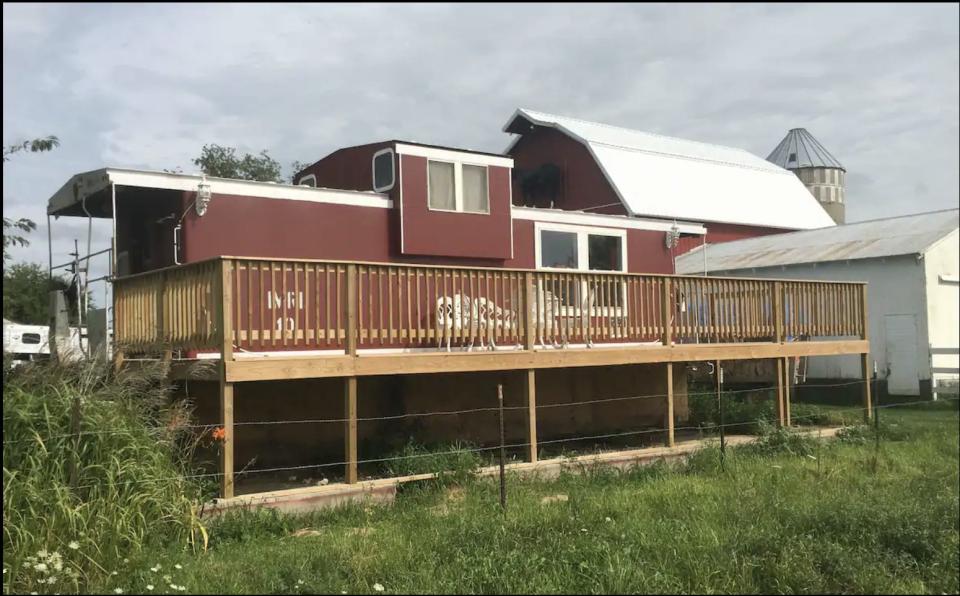 The outside space at the train caboose Airbnb in Iowa.