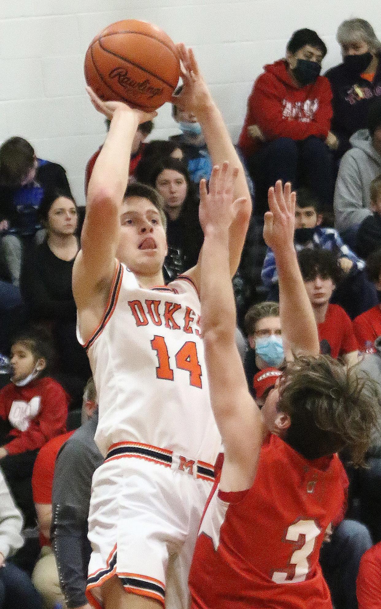 Casey Miller, shown in an earlier game, had 19 points to lead Marlington over Louisville.