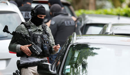 Investigators are seen during a police operation in Oullins, near Lyon, France May 27, 2019. REUTERS/Emmanuel Foudrot