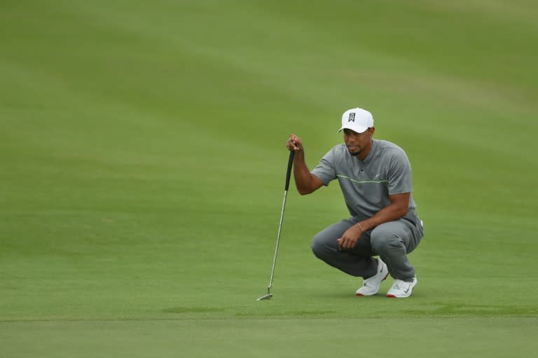 Tiger Woods lines up his putt on the first green during round three of the Hero World Challenge at Albany, The Bahamas on December 3, 2016 in Nassau, Bahamas