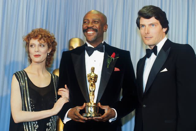 <p>Getty</p> Susan Sarandon, Christopher Reeves and Louis Gossett Jr. appear at the 1982 Academy Awards