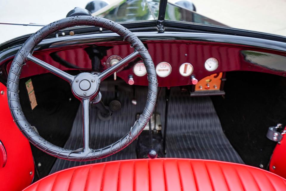 Just 10 feet long, Robert Cunningham's 1932 American Austin Bantam roadster has a cozy interior for two. The vintage-looking but aftermarket radio under the dash at right has to be removed to make the car authentic enough for Concours d'Elegance display.
