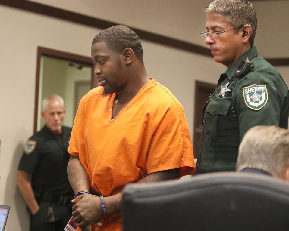 Volusia Sheriff's Office bailiffs escort Othal Wallace to the defense table, Friday, July 28, 2023, during a hearing in Judge Raul Zambrano's courtroom at the S. James Foxman Justice Center.