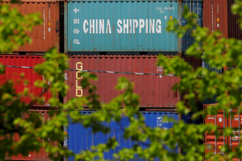 FILE PHOTO: Shipping containers, including one labelled "China Shipping," are stacked at the Paul W. Conley Container Terminal in Boston, Massachusetts, U.S., May 9, 2018. REUTERS/Brian Snyder/File Photo