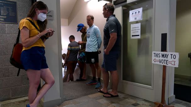 PHOTO: People wait in line to vote early ahead of Tuesday's Republican primary election in Jackson, Wyo., on Aug. 15, 2022. (Jae C. Hong/AP)