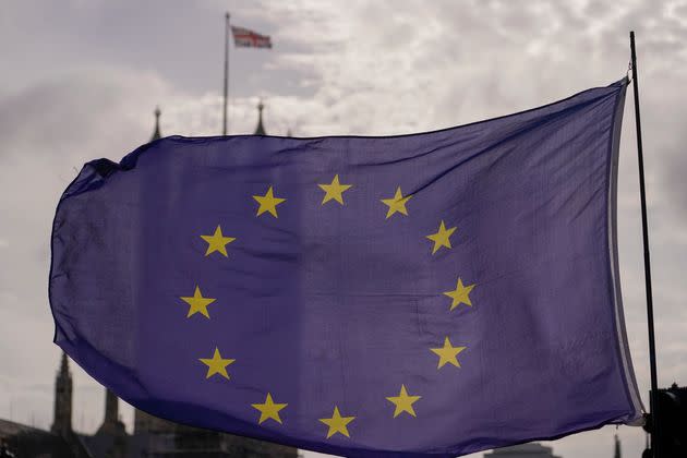 A European Union flag flies outside the Houses of Parliament.