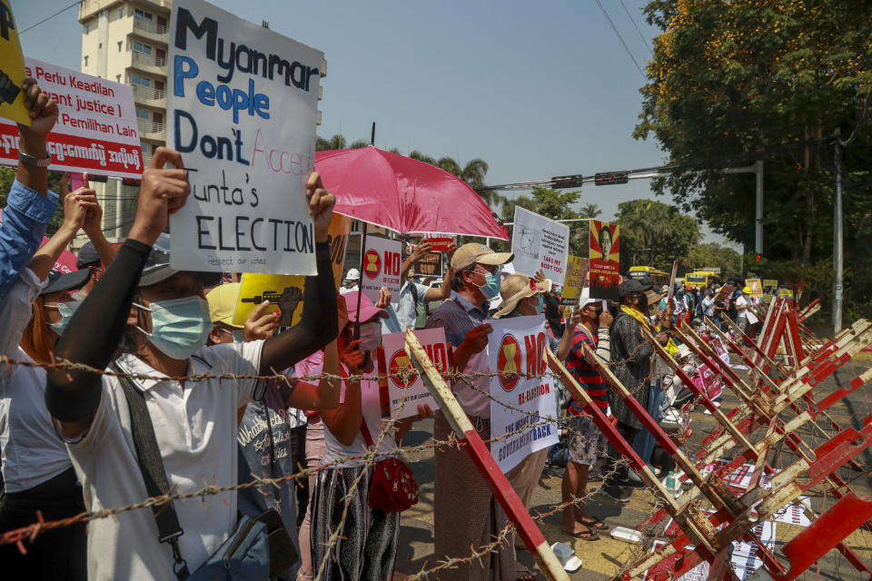 Anti-coup protesters rally close to the Indonesian Embassy in Yangon, Myanmar, Wednesday, Feb. 24, 2021. Anti-coup protesters gathered outside the Indonesian Embassy following reports that Indonesia was seeking to have fellow members of the Association of Southeast Asian Nations to agree on an action over the Myanmar's coup that would hold the junta to its promise to hold free and fair elections in a year's time. The Indonesia Foreign Ministry has denied the report. (AP Photo)