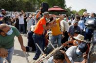 Tunisians gather after president ousts government, in Tunis