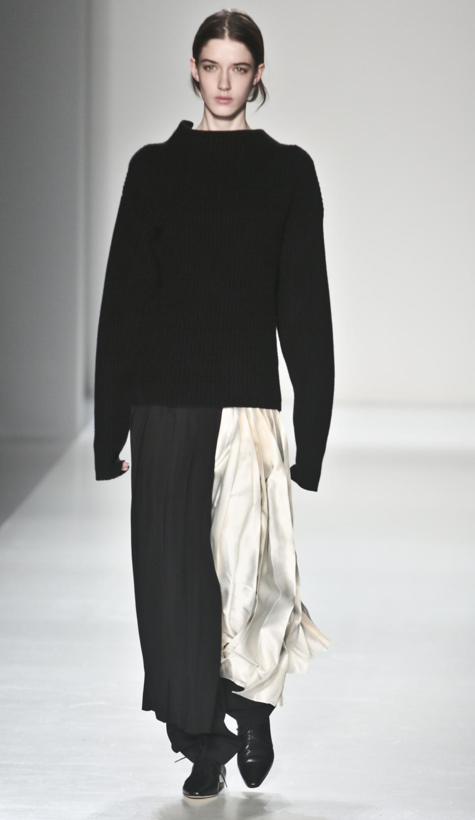 Fashion from the Victoria Beckham Fall 2014 collection is modeled, during New York Fashion Week on Sunday, Feb. 9, 2014. (AP Photo/Bebeto Matthews)