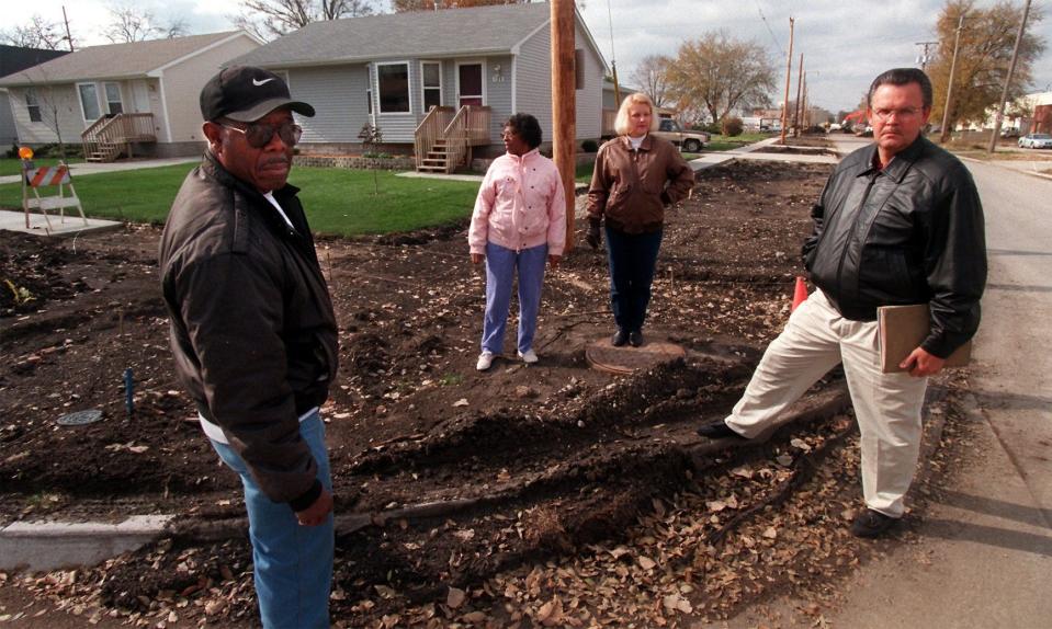 Left to right at a construction site near their homes south of Maple Street at 11th Street in Valley Junction were John Long, Barbara Long, Mary Engler and Ed Engler. The sidewalks were poorly graded and the work was incomplete.