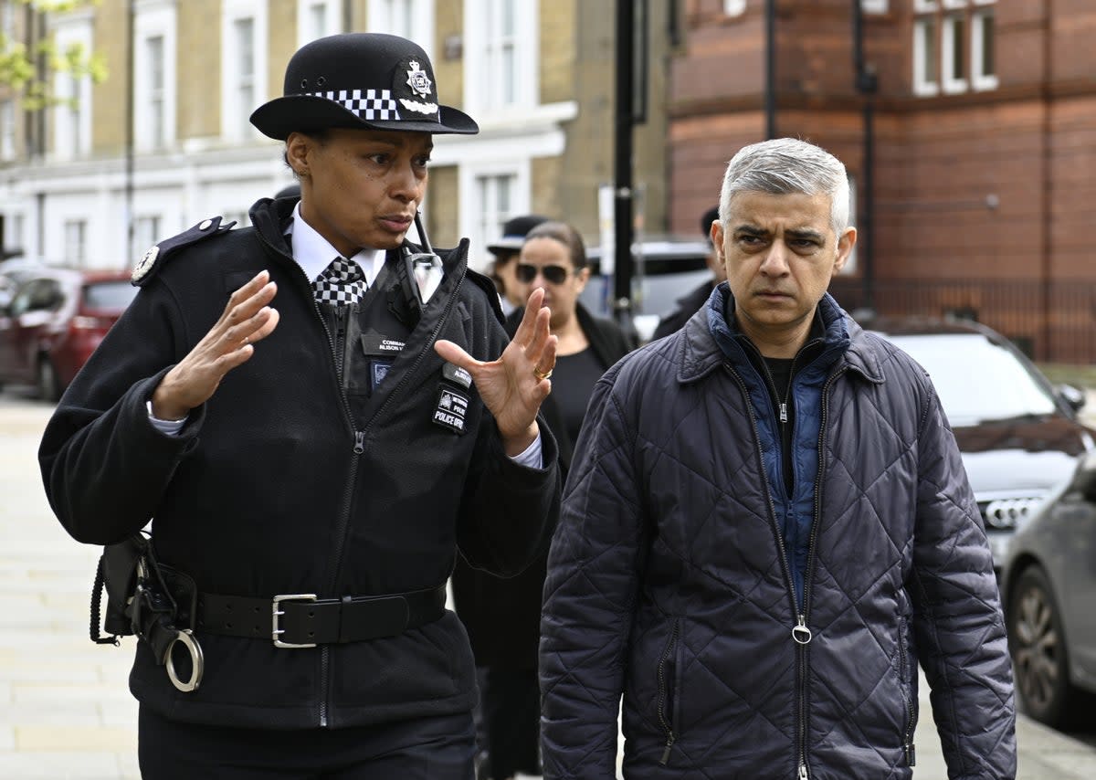 Mayor of London Sadiq Khan and Metropolitan Police Commander Alison Heydari during a visit to an estate in Westminster in April 2023  (PA)