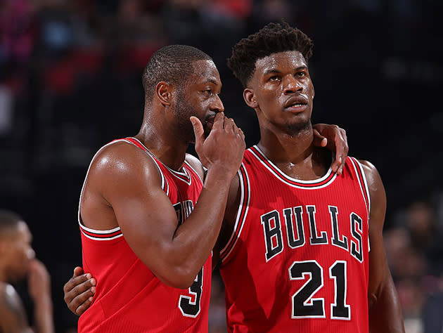 Dwyane Wade and Jimmy Butler chat it up. (Getty Images)