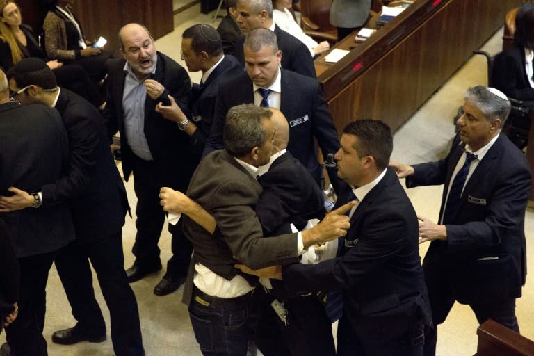 Israeli Arab members of parliament scuffle with security officers after they disrupted a speech by US Vice President Mike Pence on January 22, 2018 in protest at Washingtont's recognition of Jerusalem as Israel's capital