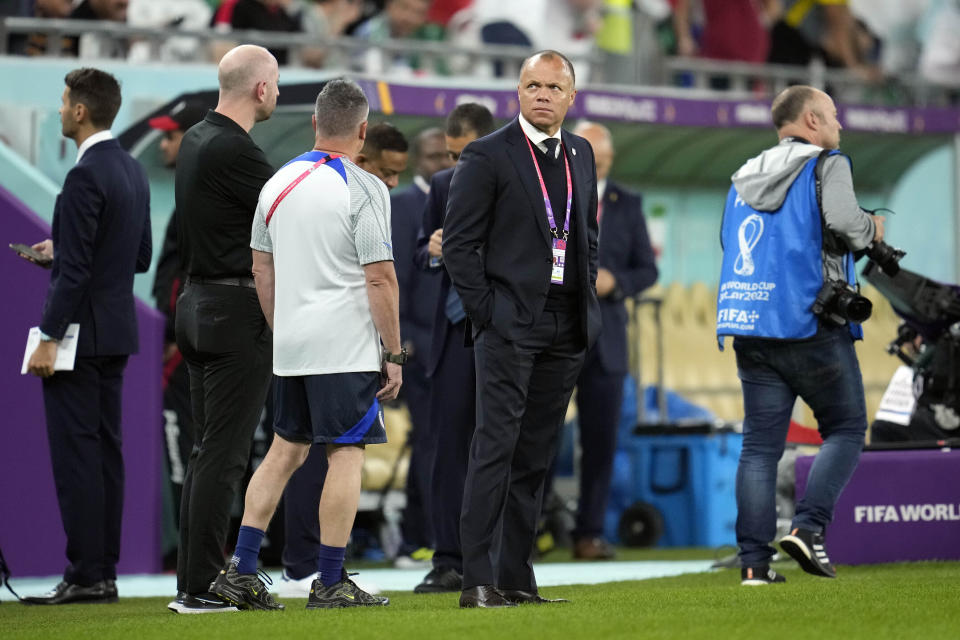 FILE - US Soccer Federation sporting director Earnie Stewart stands on the field before the World Cup group B soccer match between Iran and the United States at the Al Thumama Stadium in Doha, Qatar, Tuesday, Nov.  29, 2022. US Soccer Federation sporting director Earnie Stewart is leaving to join PSV Eindhoven following the departure of American general manager Brian McBride, a management shakeup that leaves men's coach Gregg Berhalter in uncertainty.  (AP Photo/Ashley Landis, File)