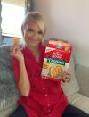 <p>Kristin Chenoweth gets cozy at home on the couch with Town House crackers and her “Cheno-Worth It” dip.</p>