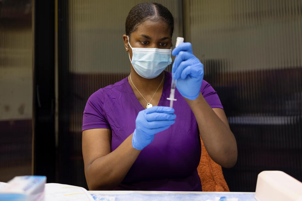 A vaccinator draws a coronavirus disease (COVID-19) vaccine at a clinic run by the Philadelphia Department of Public Health in partnership with the Black Doctors COVID-19 Consortium to encourage all eligible teenagers to get vaccinated in Philadelphia, Pennsylvania, U.S., May 18, 2021. REUTERS/Hannah Beier